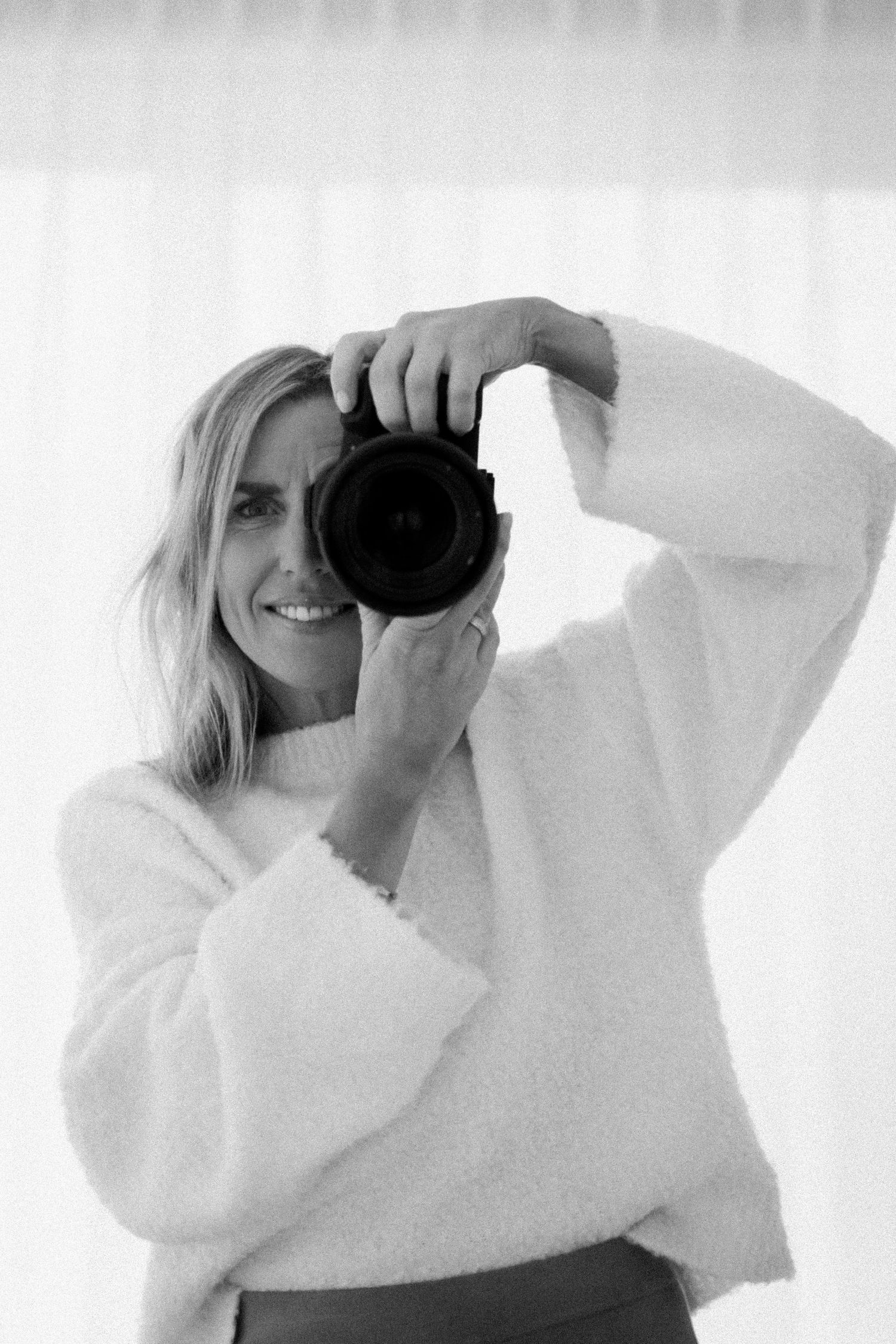 Artistic sequence of images showing camera lens against bright white background.