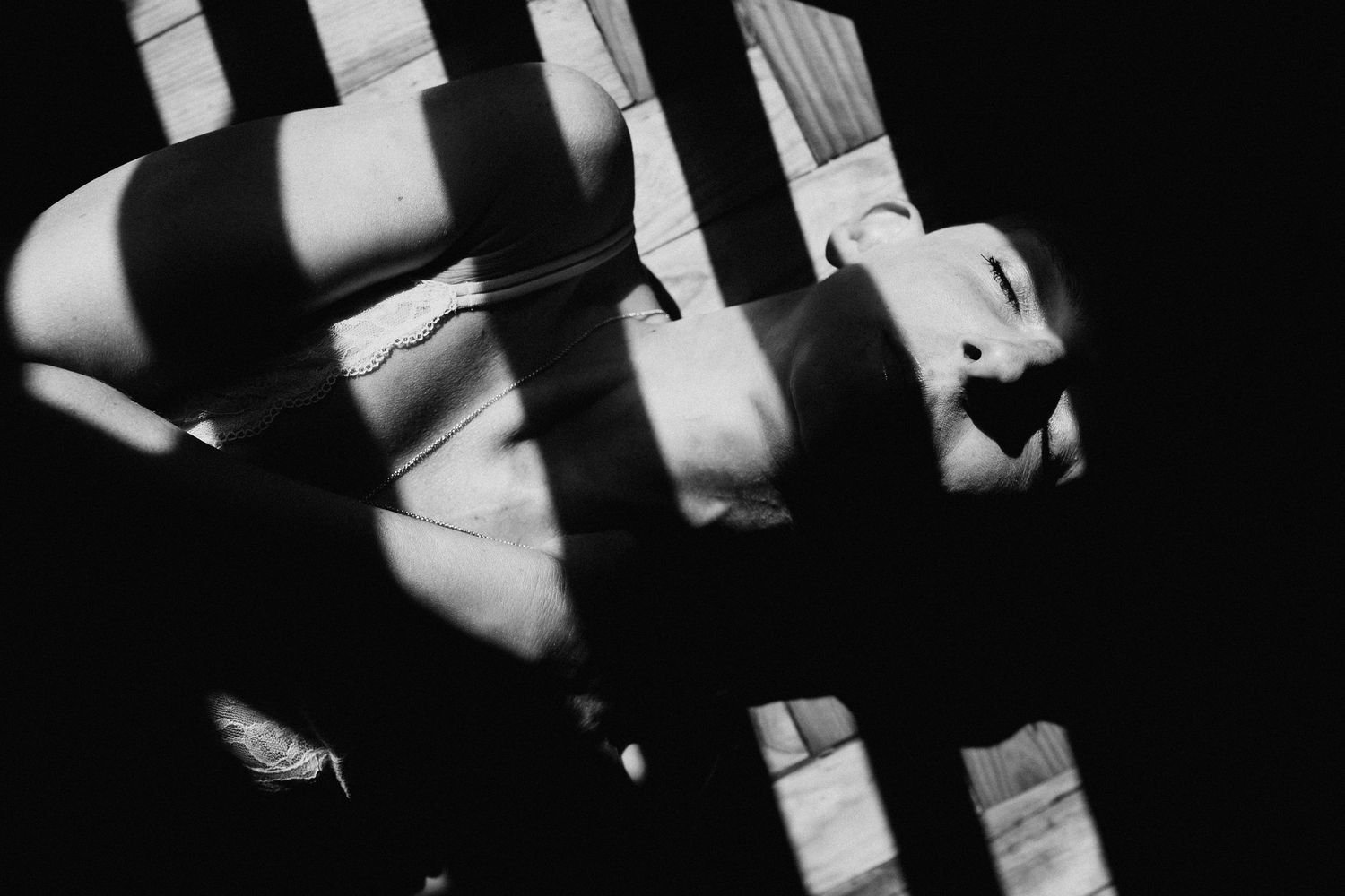 Abstract black and white composition with strong geometric shadows and lines.