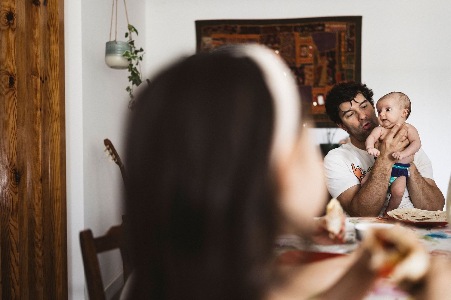 A collection of candid family moments captured in warm lighting through multiple connected photographs.