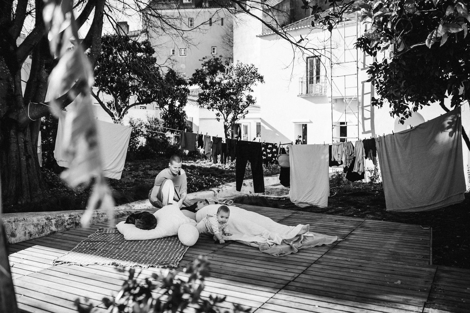 Outdoor deck scene with natural lighting and casual gathering atmosphere.