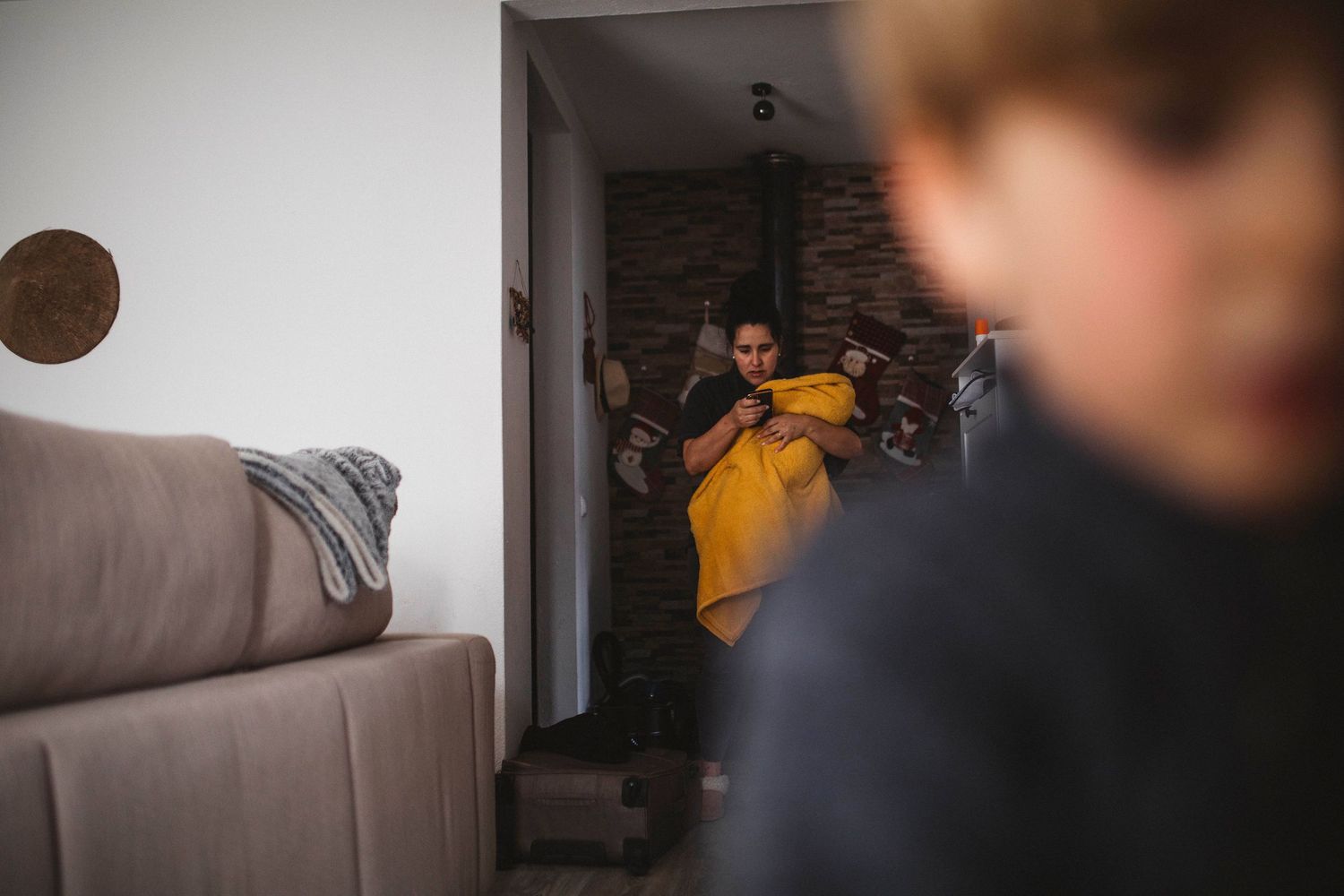 Lifestyle family photography sequence captured in bright modern bedroom.