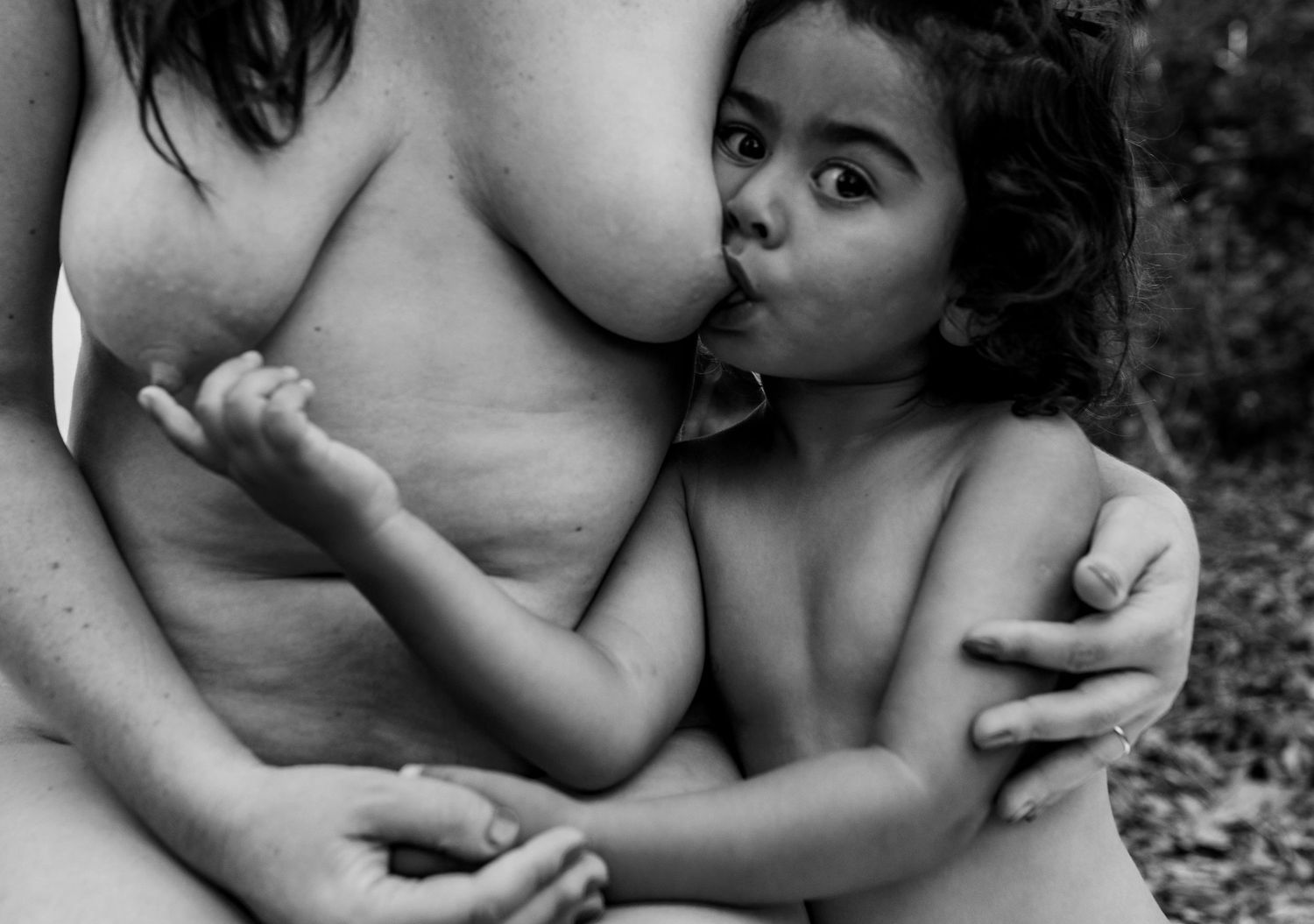 Black and white artistic photo series showing tender embraces and intimate moments between a couple.