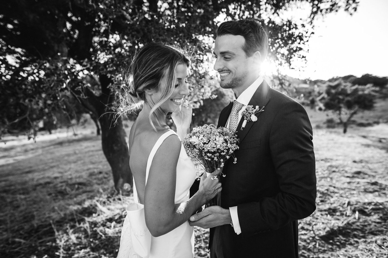 Couple shares a tender moment during their outdoor wedding photoshoot.