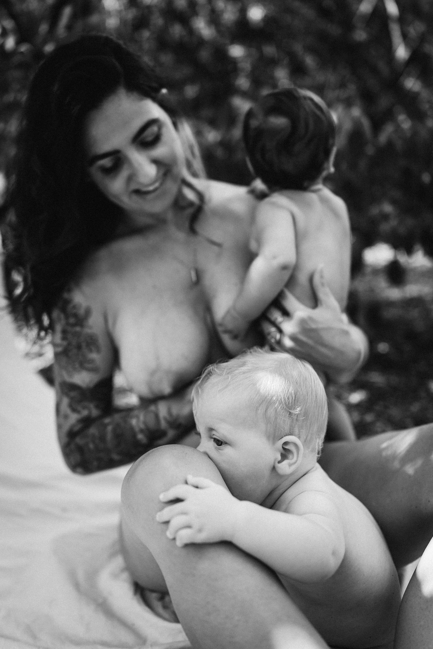 Intimate black and white photography capturing tender moments in natural light.