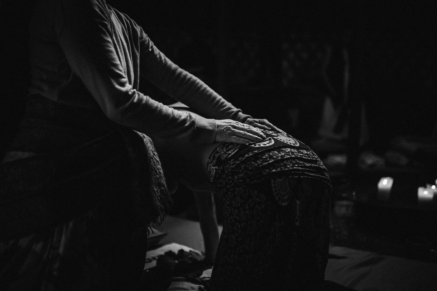 Black and white photo series showing hands playing a piano keyboard with dramatic lighting and shadows.