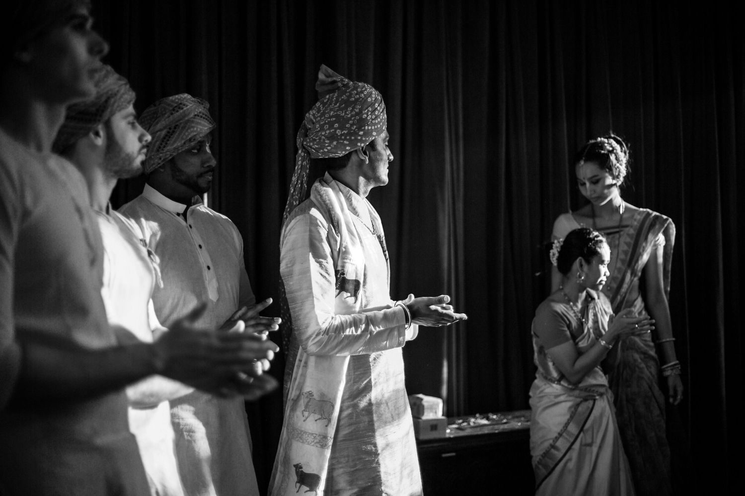A series of black and white photographs showing people dancing and socializing at what appears to be a formal event.