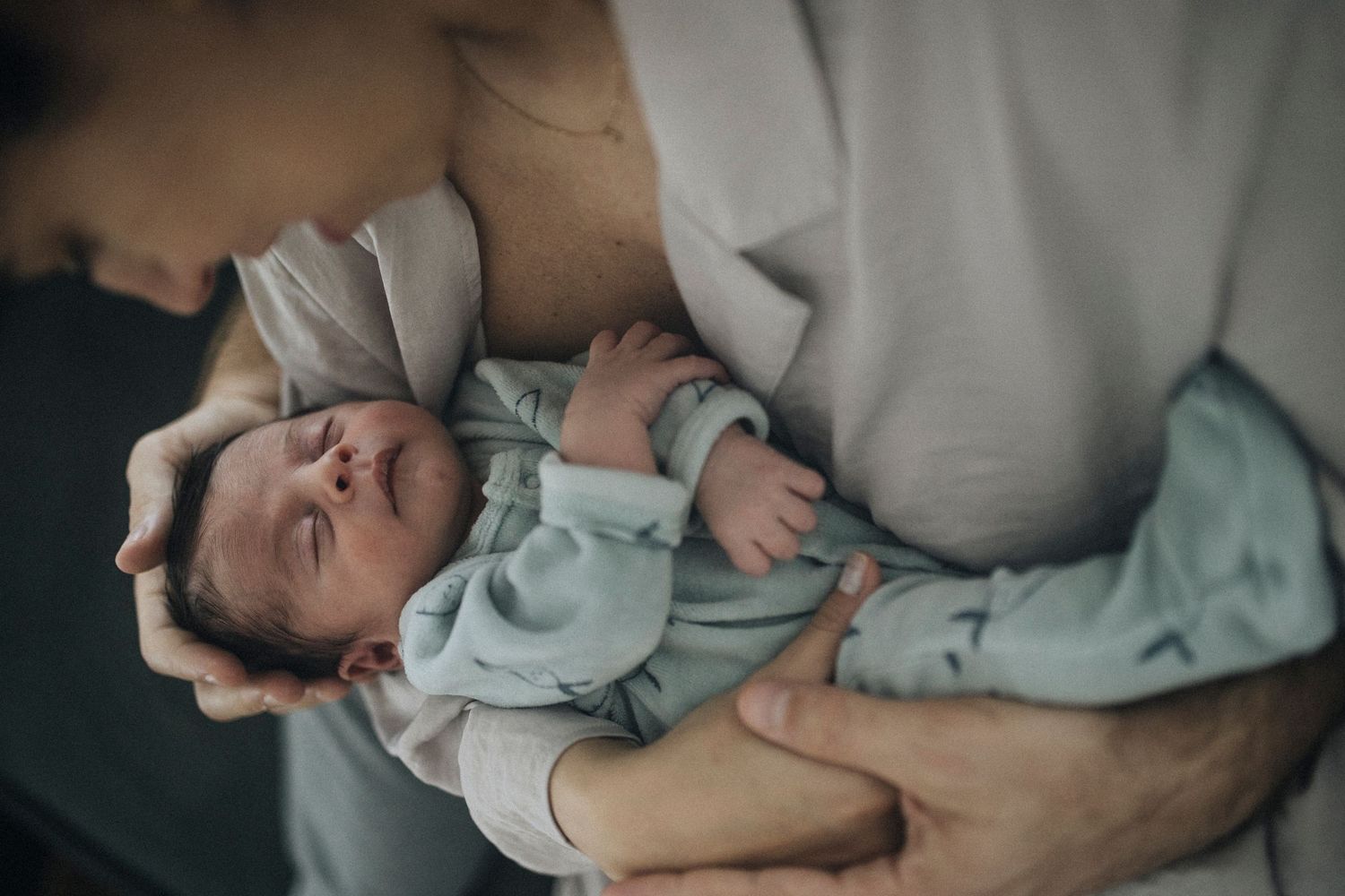 Soft, muted tones capture gentle caregiving moments in a domestic setting.