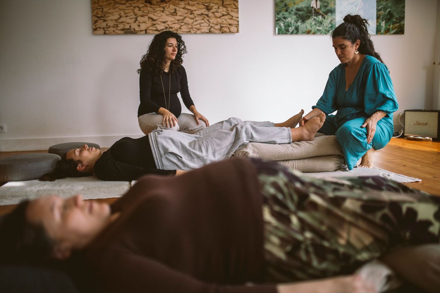 A series of photos showing someone receiving a Reiki healing treatment on a massage table in a peaceful room.