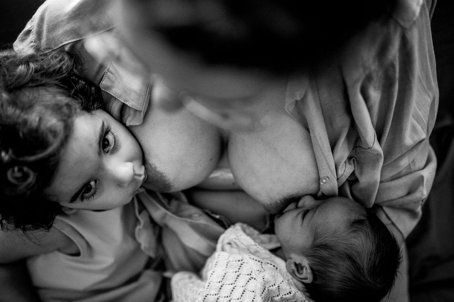 Series of artistic black and white photographs capturing intimate family moments.