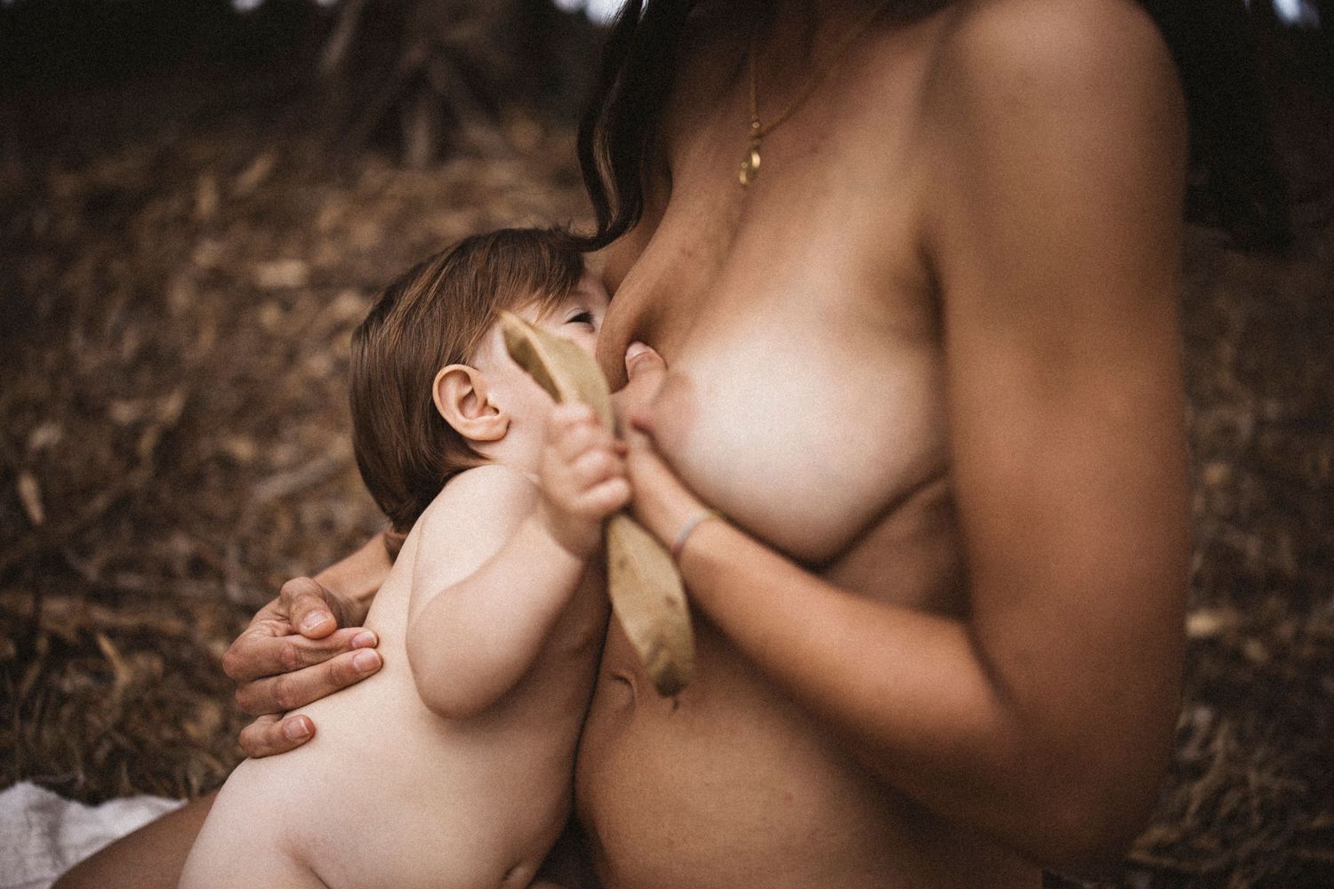 Artistic portrait capturing intimate moments in warm natural lighting.