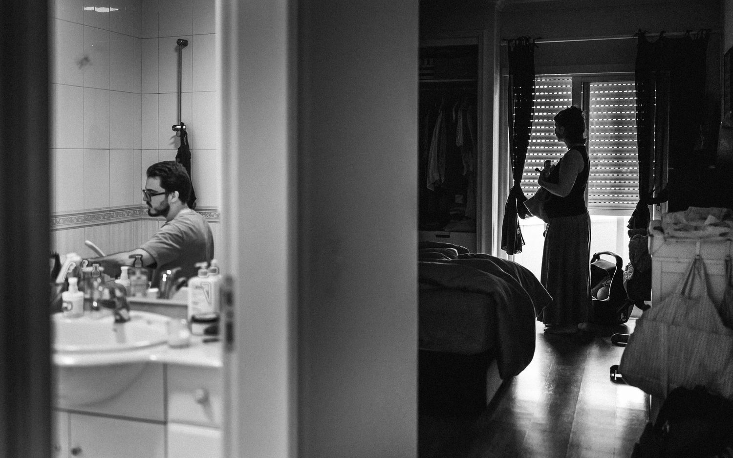 A series of black and white photographs showing interior spaces with dramatic lighting and shadows.