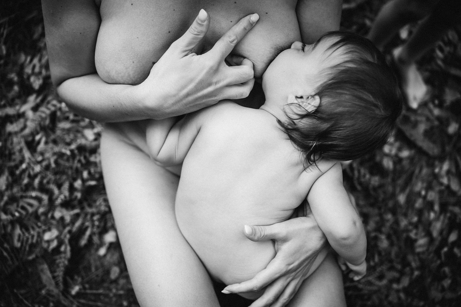 Intimate black and white photography showcasing nurturing connection in nature.