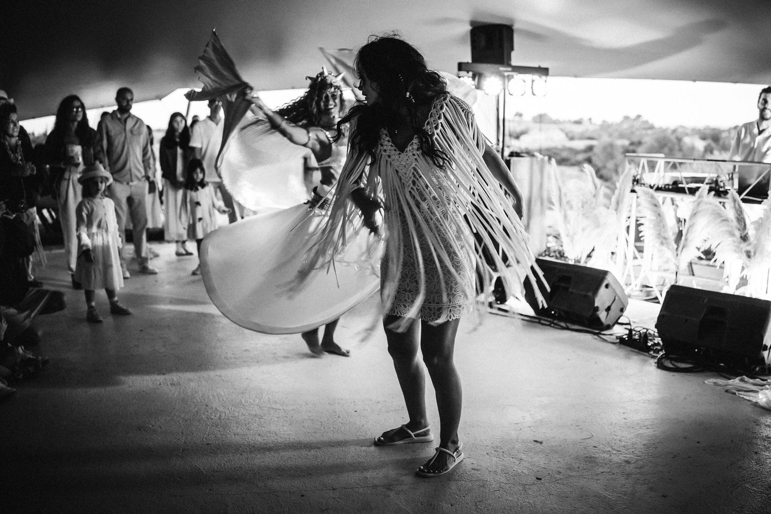 Black and white photos of dancers moving gracefully across a performance space.
