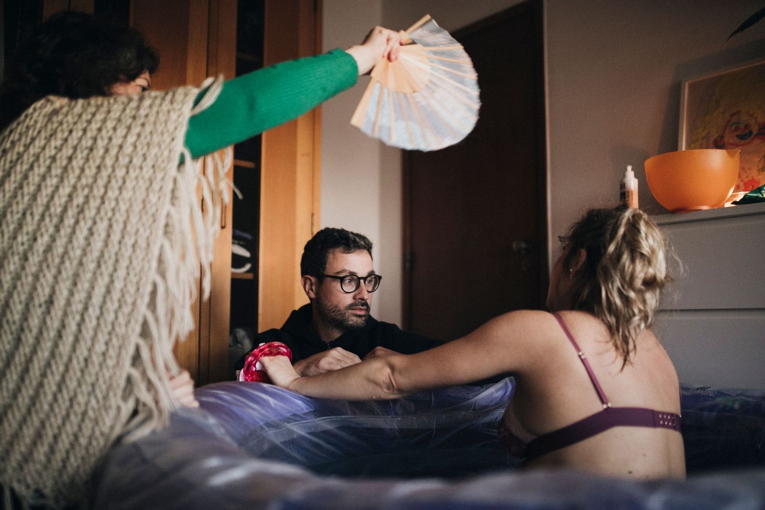 A person lies on a massage table while receiving a professional therapeutic massage treatment.