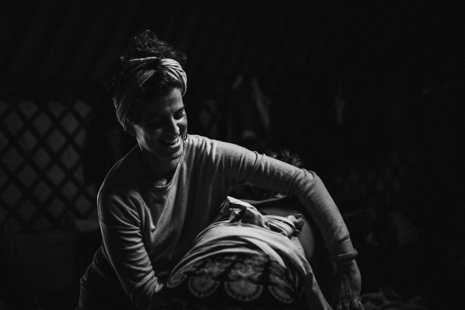 A dramatic black and white photo sequence shows a person performing a breakdancing move on the ground.