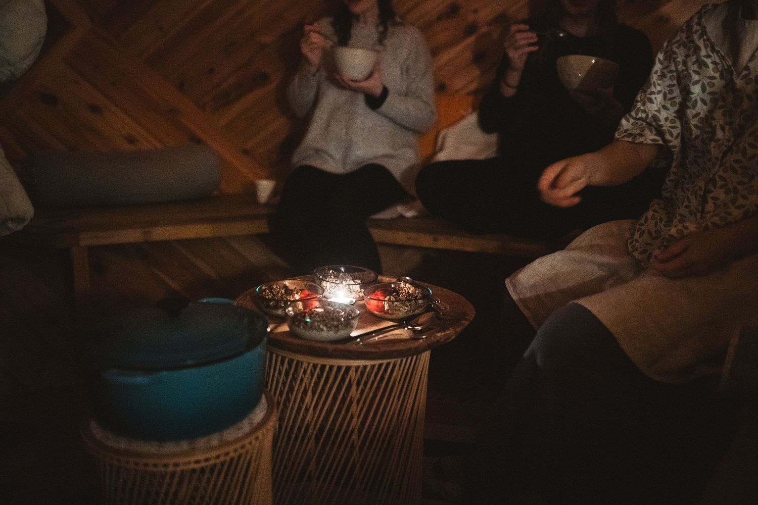 Cozy indoor gathering space with warm lighting and comfortable seating arrangements.