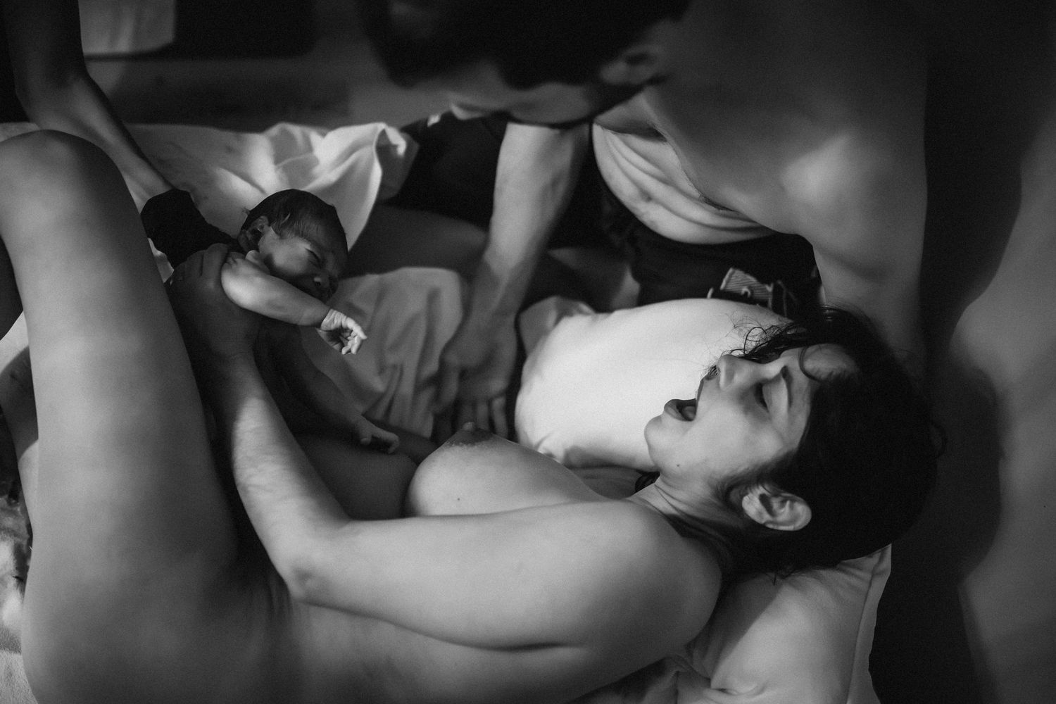 Black and white artistic nude photographs arranged in a horizontal collage showing intimate poses and body forms.