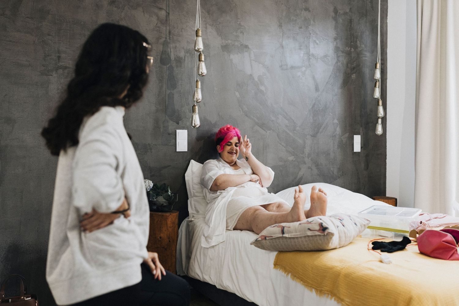 Series of intimate wedding preparation moments captured in a minimalist room with natural light.