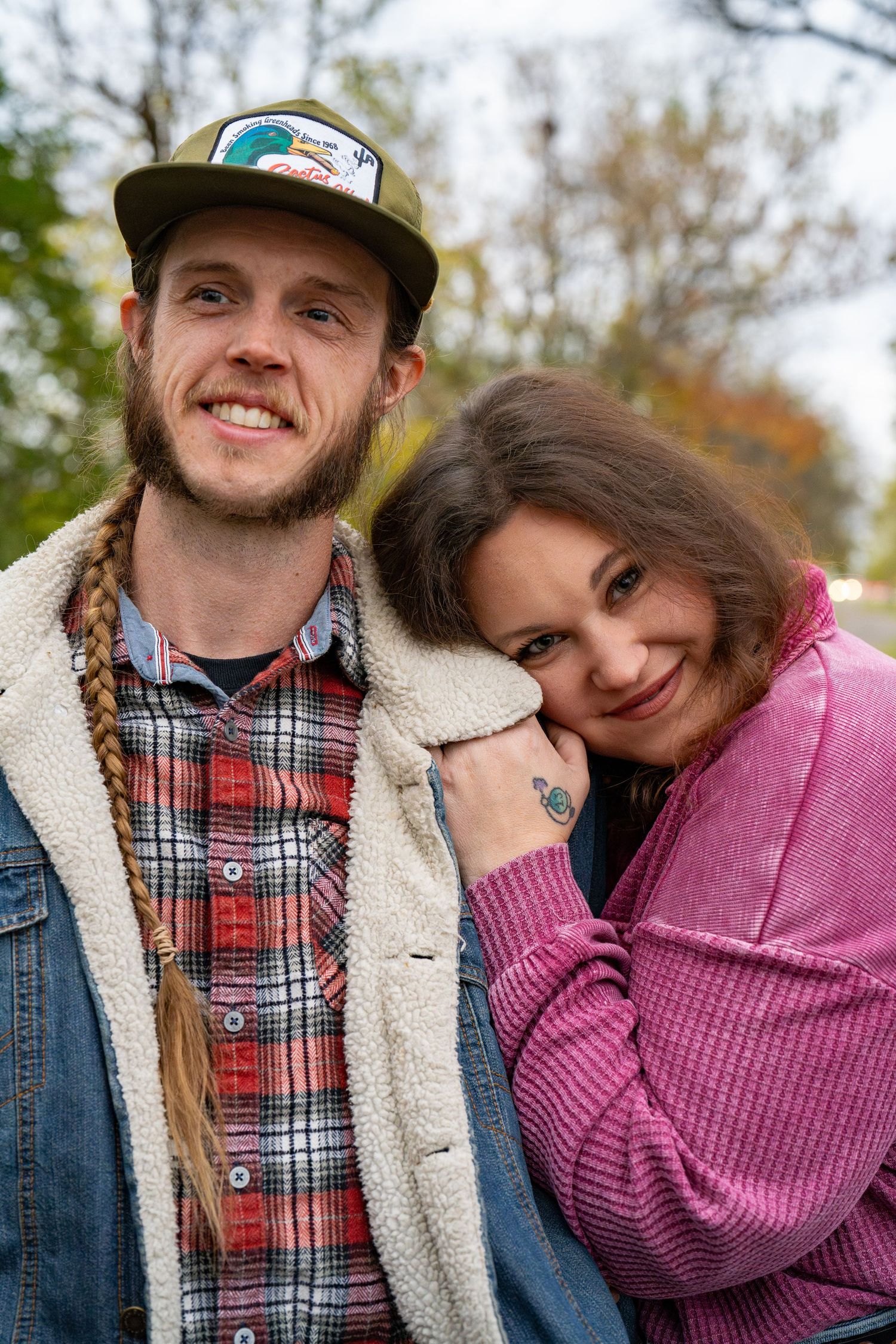 Couple embracing during a relaxed fall portrait session.