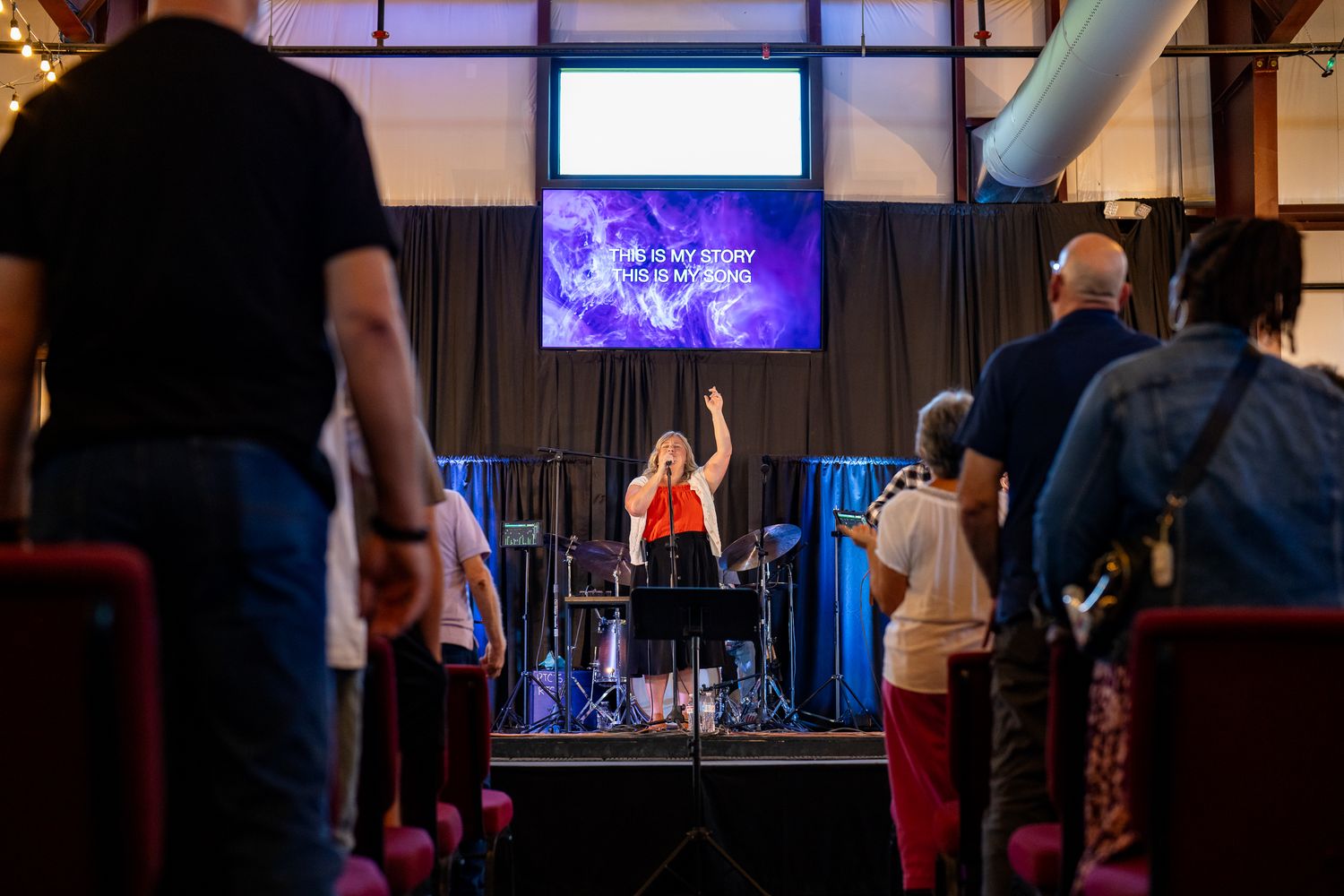 Congregation gathered for worship during an indoor church service.