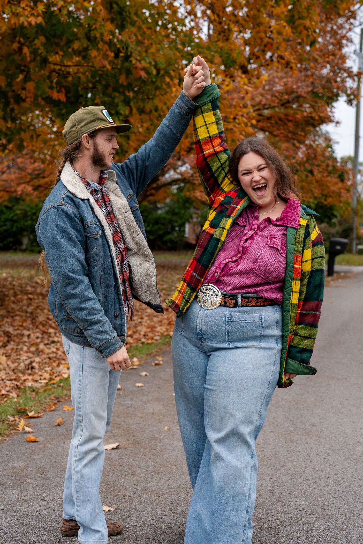 Couple laughing together during a casual fall portrait session.