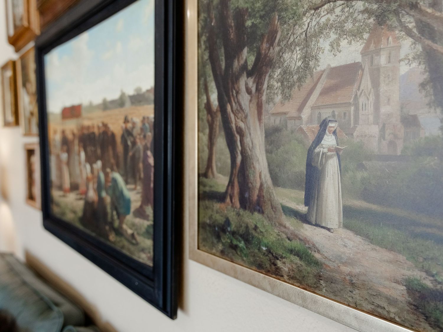 framed gallery wall art in a coffee shop next to a window