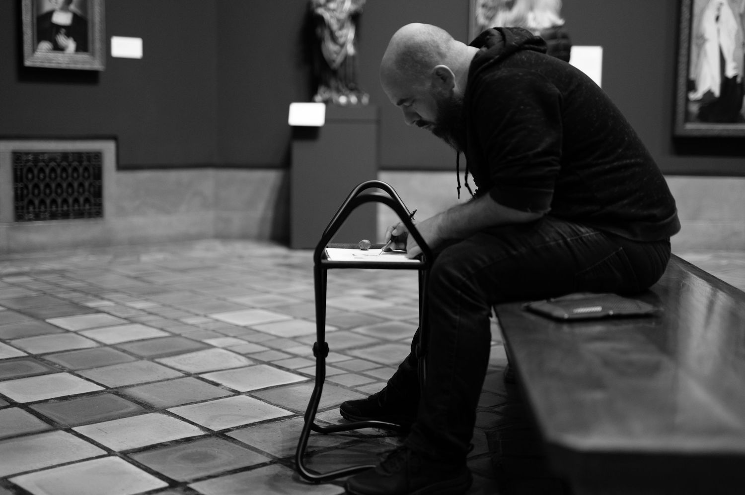 Veteran in Art Museum drawing inspiration as he works on his skills as an artist. Image taken by veteran photographer and Two Black Ravens f