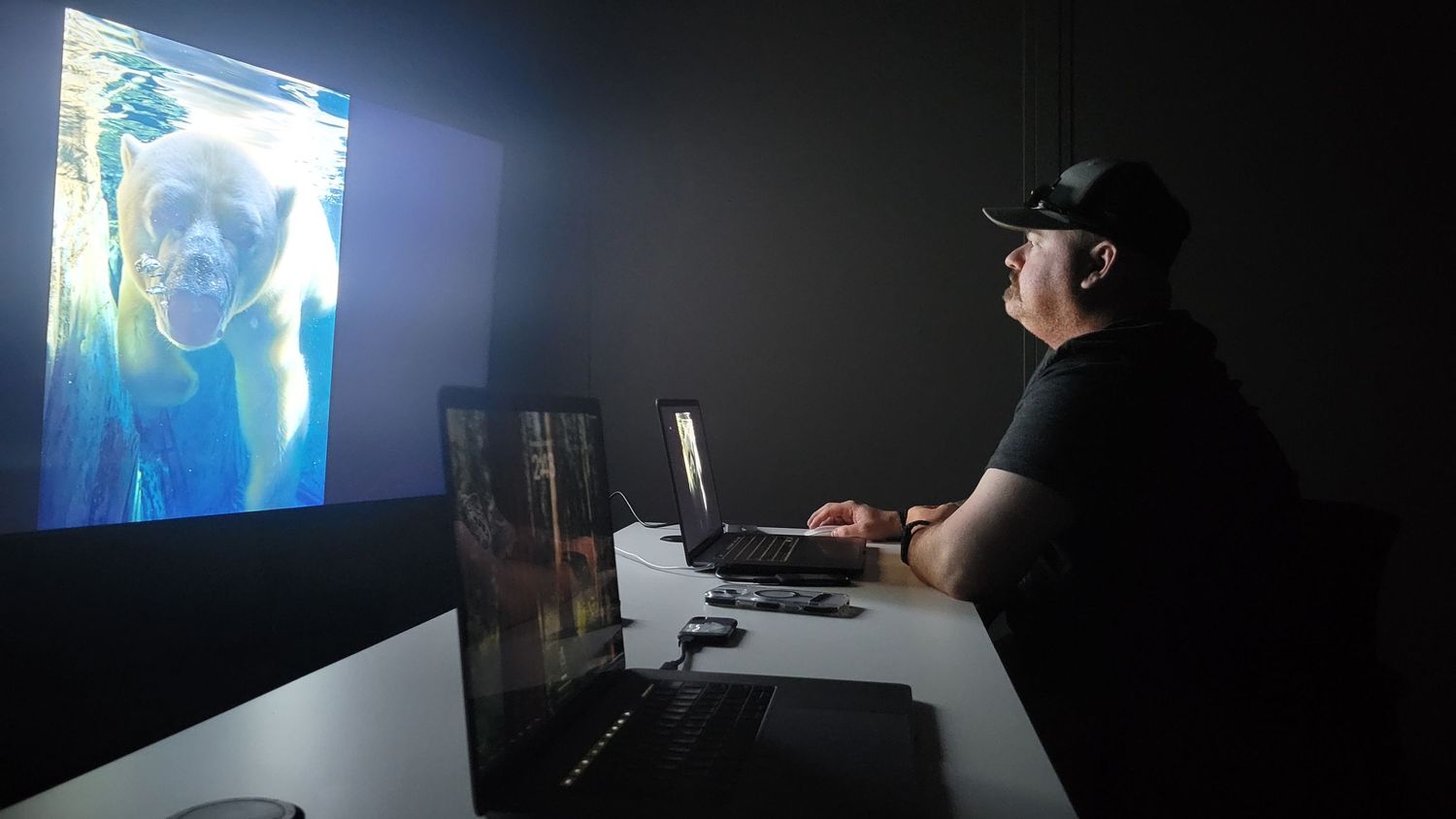 Veteran at a Two Black Ravens Program editing his photo of a Polar Bear from the Saint Louis Zoo. Image taken by veteran photographer Adam