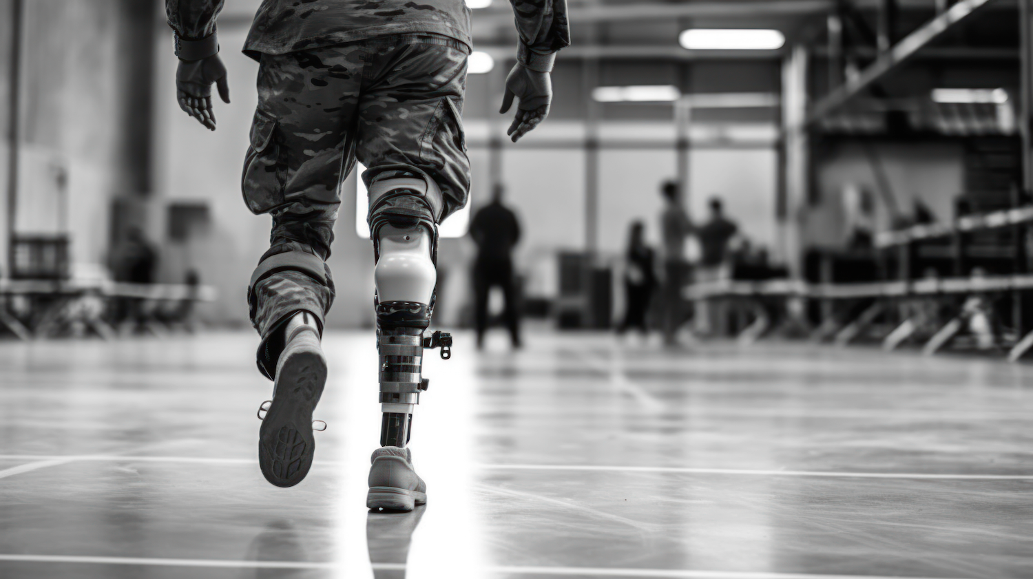 Military member in uniform with a prosthetic leg rehabilitating.