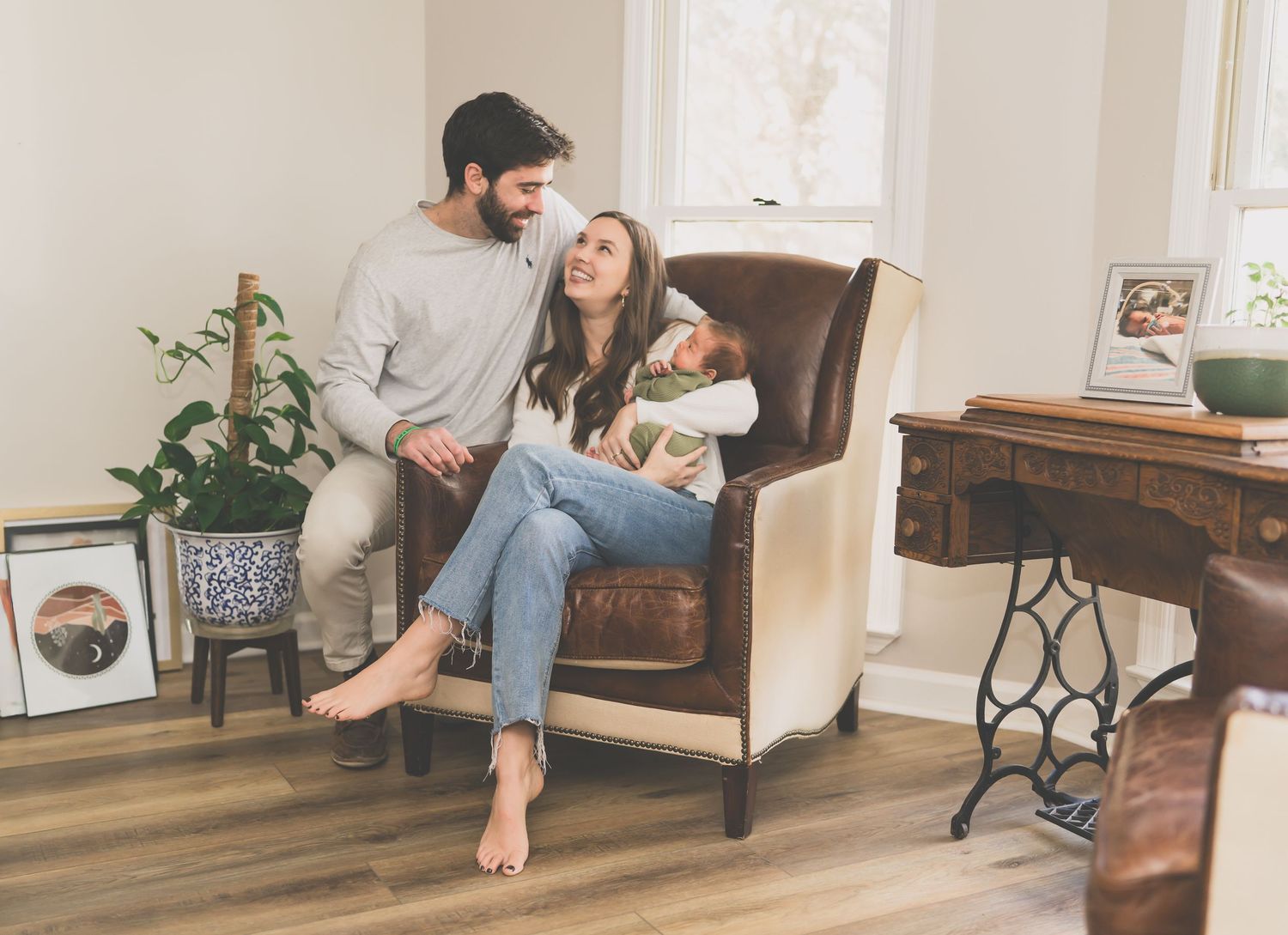 A series of photos showing someone installing wood-look vinyl plank flooring in a living room.