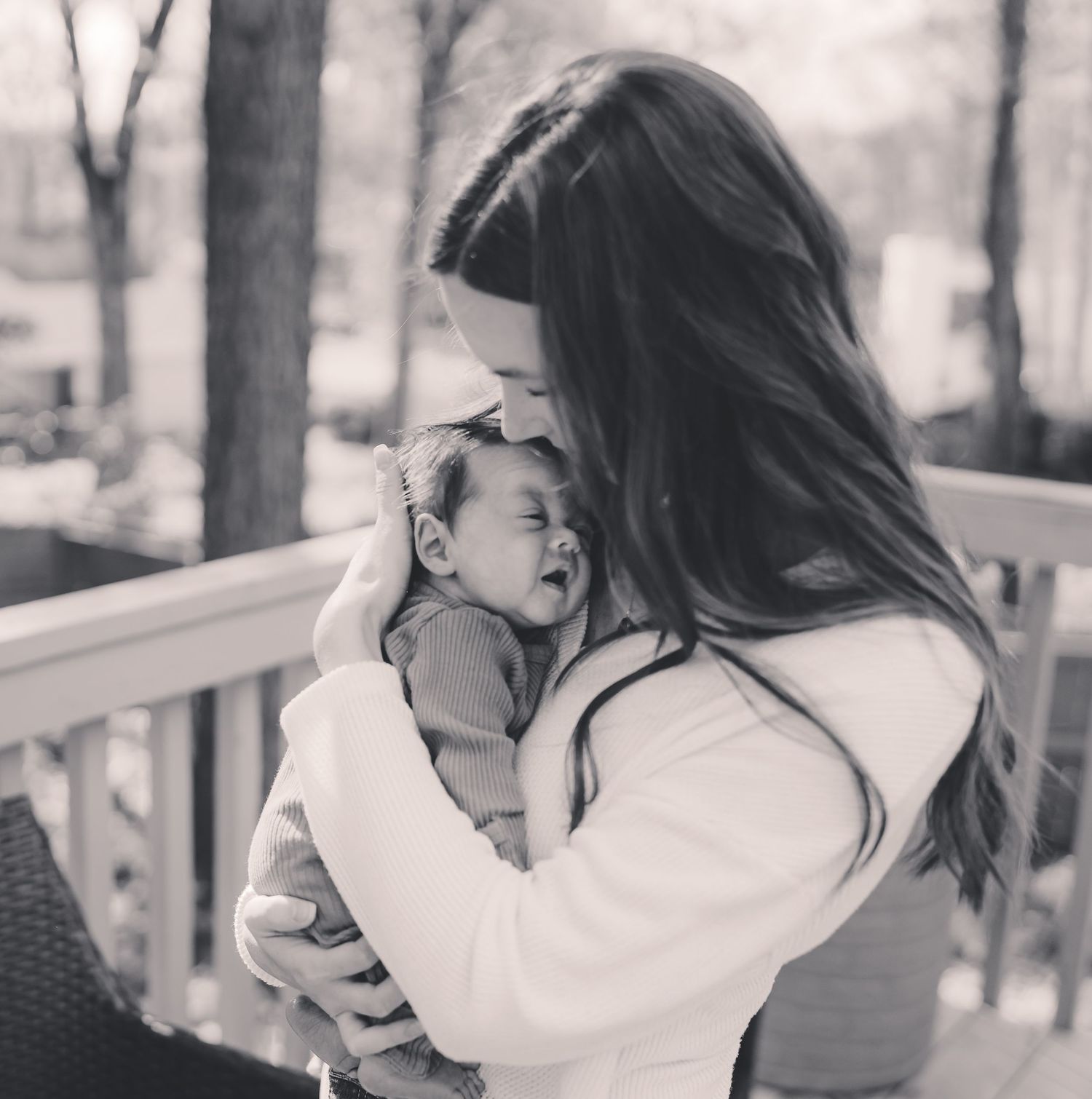 Black and white series of romantic outdoor couple photos showing intimate embraces and tender moments.