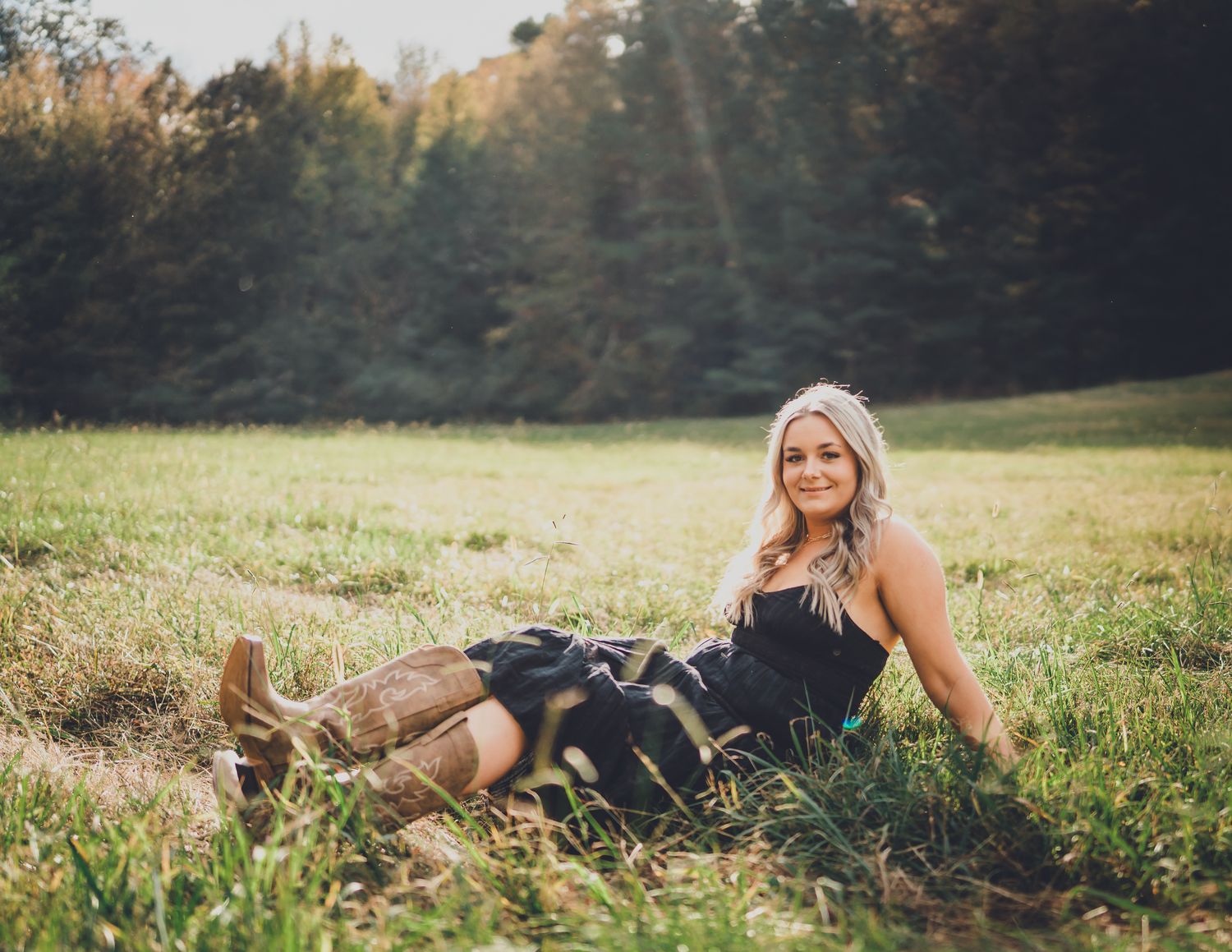 A series of lifestyle portraits taken in a golden autumn meadow during sunset showing relaxed poses in nature.