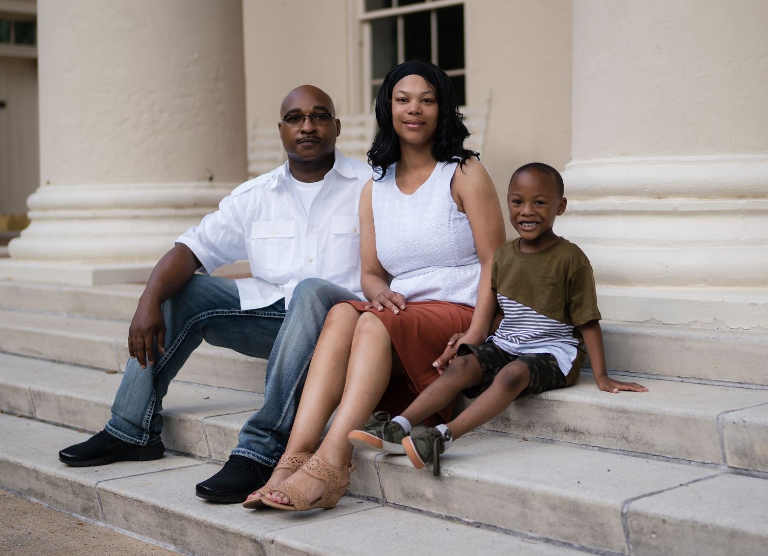 A series of five connected photos showing a family sitting and posing on white stone steps outdoors.