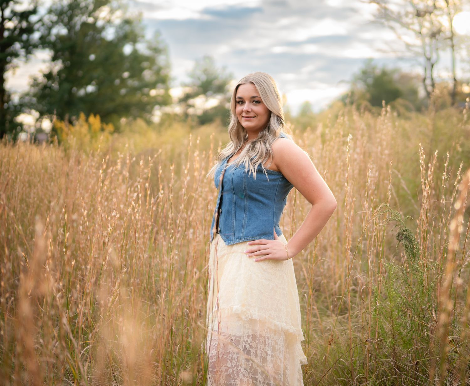 Ethereal outdoor photography series with golden hour lighting and tall grass creating a romantic atmosphere.