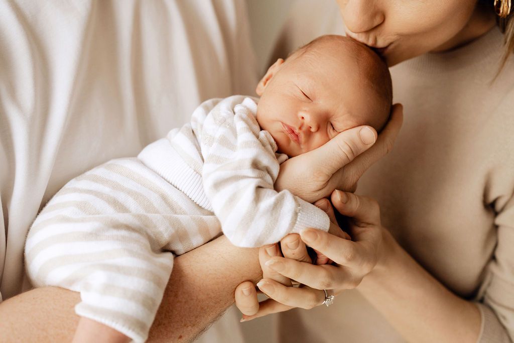 heartfelt newborn moment during photoshoot in dubai