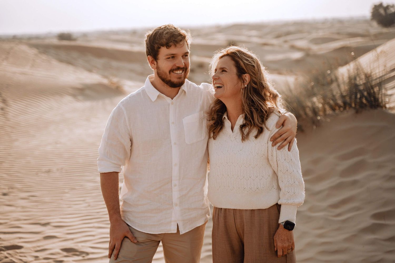 Desert landscape photoshoot featuring natural poses and earth-toned styling.