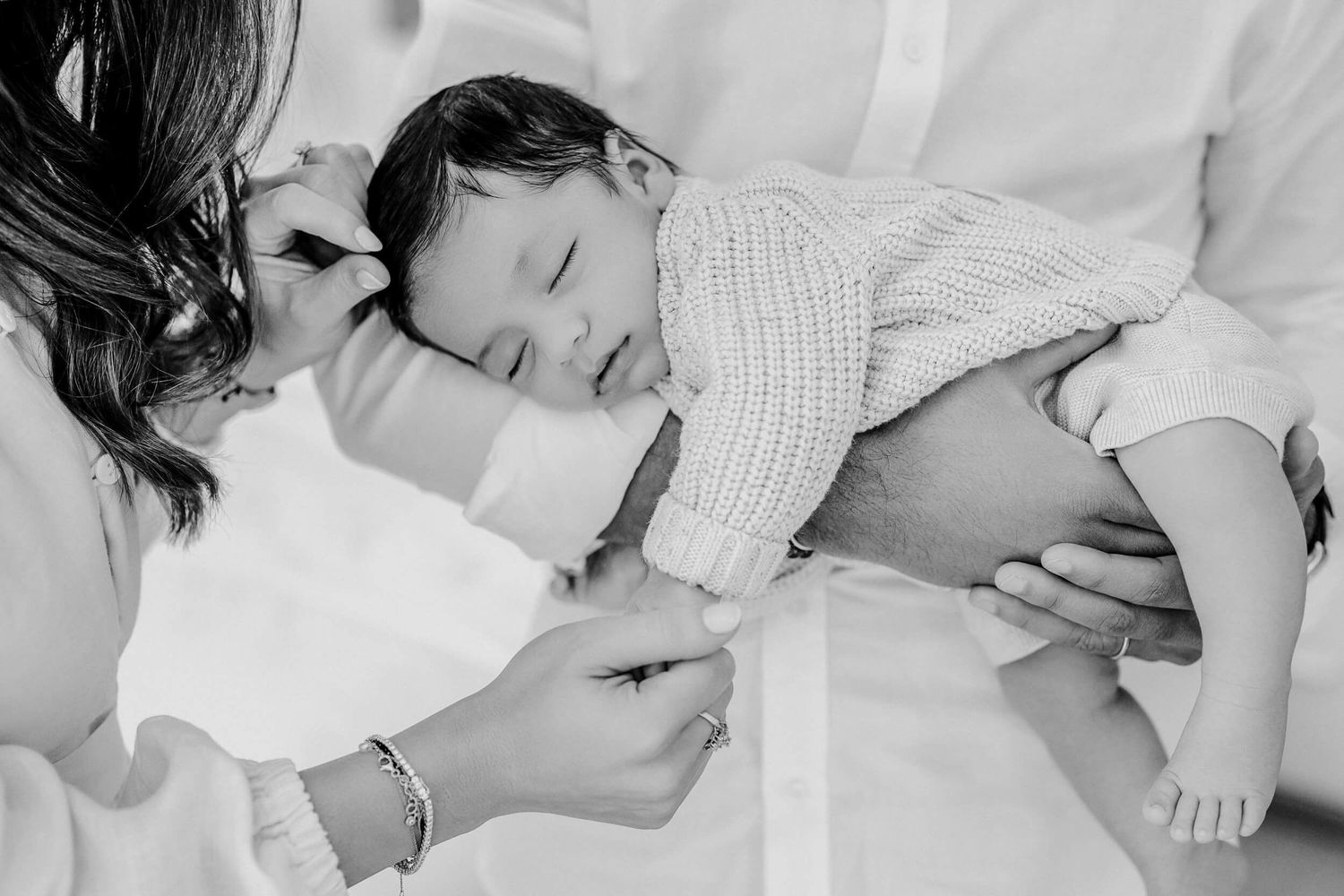 Intimate family photography sequence showing tender moments between parents and child.