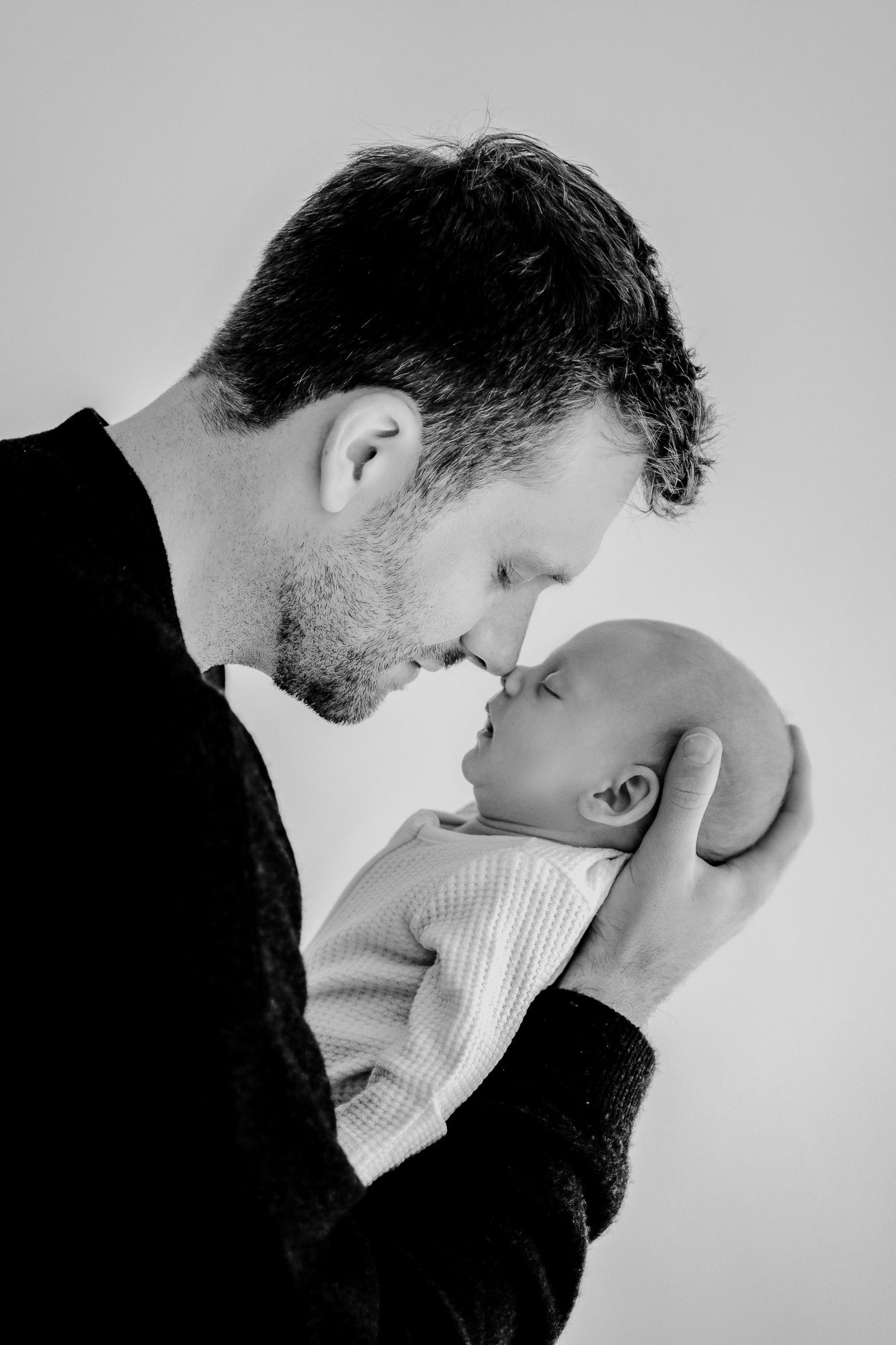 Two people share intimate black and white close-up moments across multiple sequential photos.