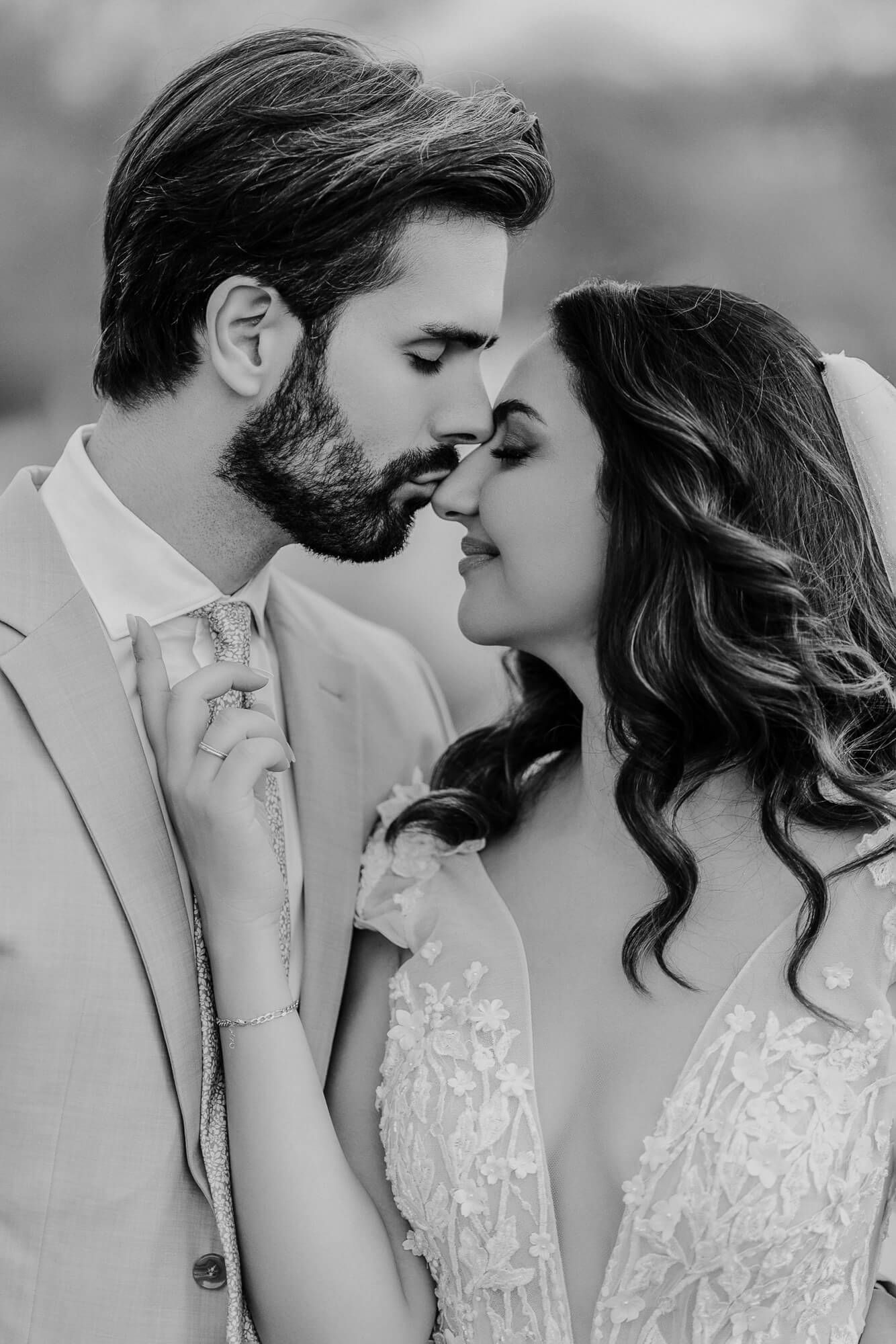 Romantic black and white photo series showing tender moments between a couple about to kiss.