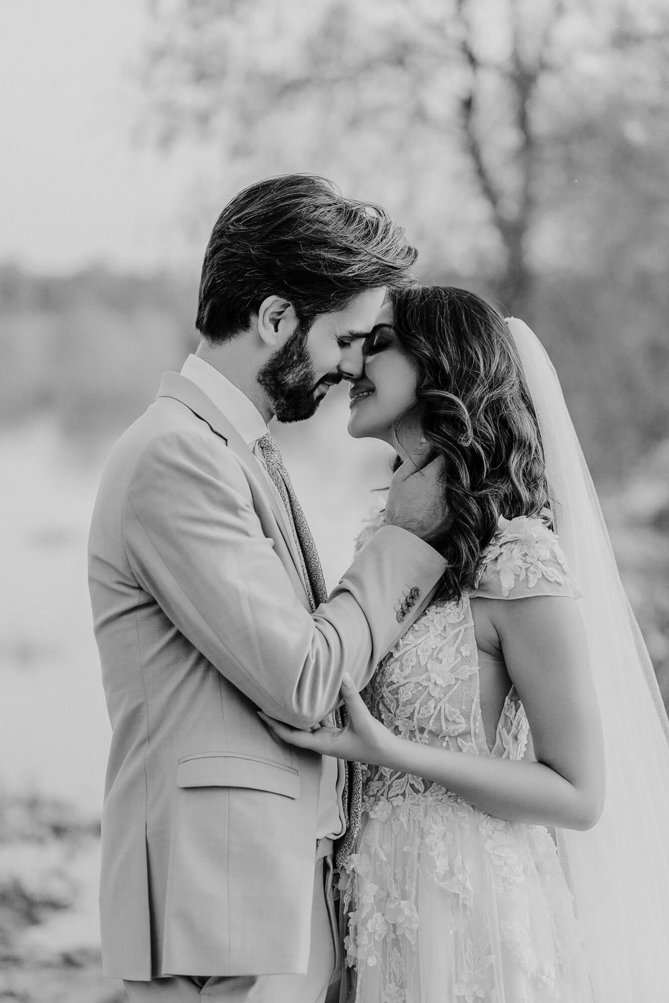A romantic black and white four-panel sequence shows a couple in wedding attire sharing intimate moments outdoors.