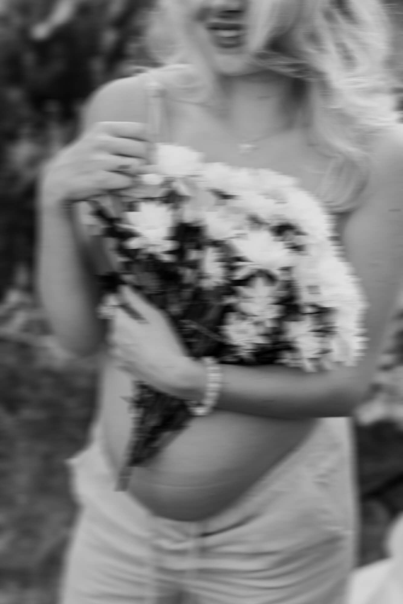 Soft focus portrait with black and white daisy bouquet.