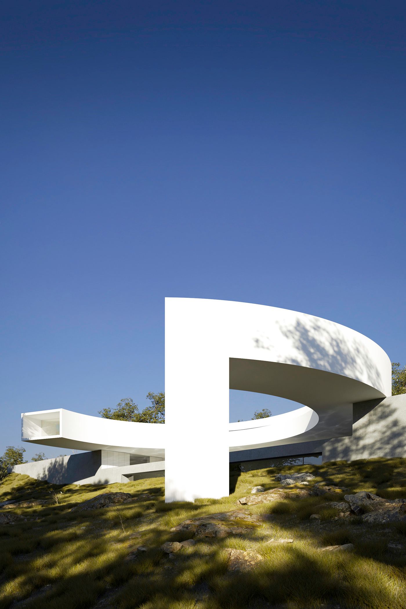 Modern white curved architectural structure with sweeping forms sits against bright blue sky on grassy hillside.