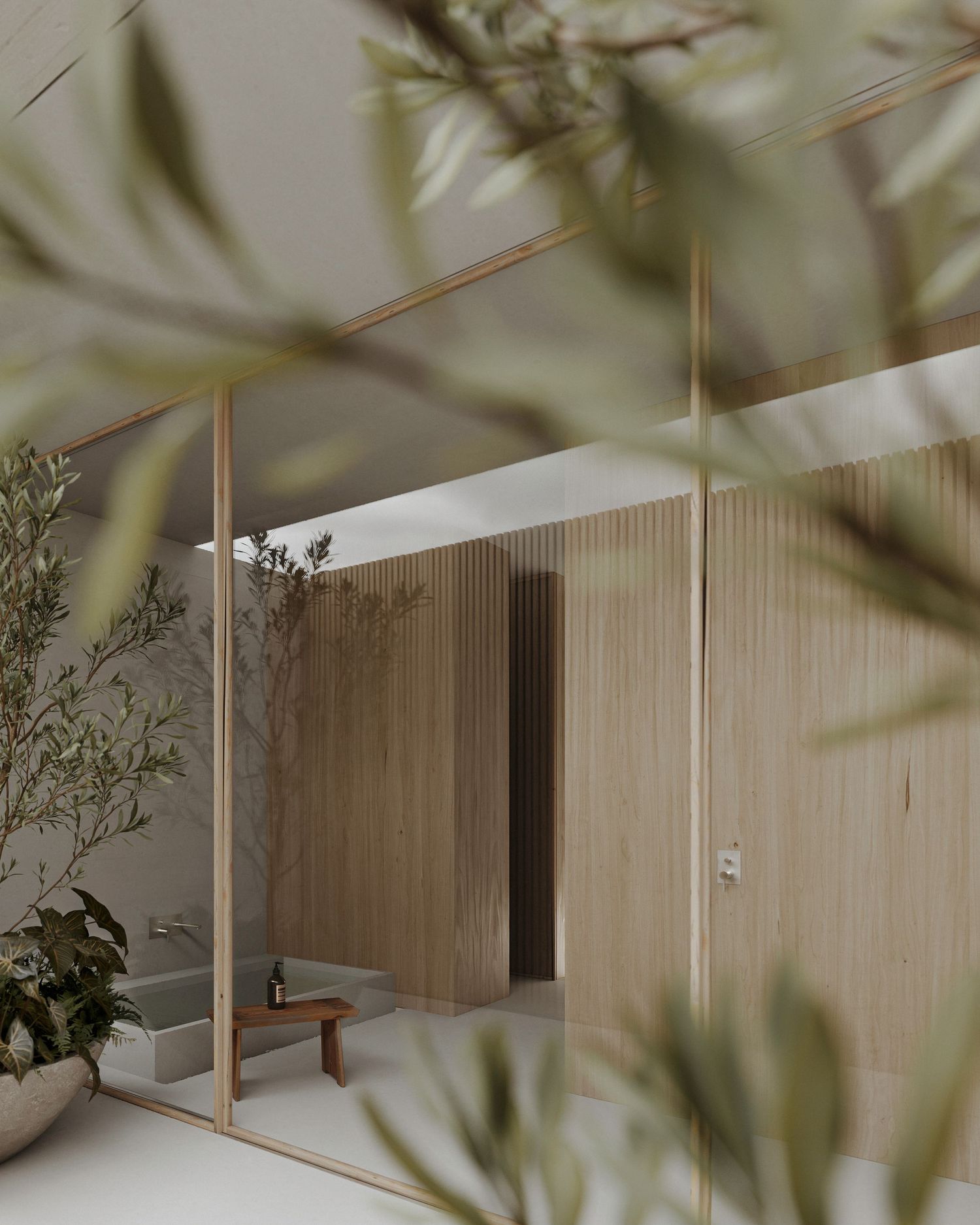 Modern minimalist interior with wooden slat walls viewed through blurred foliage, featuring clean lines and natural materials.