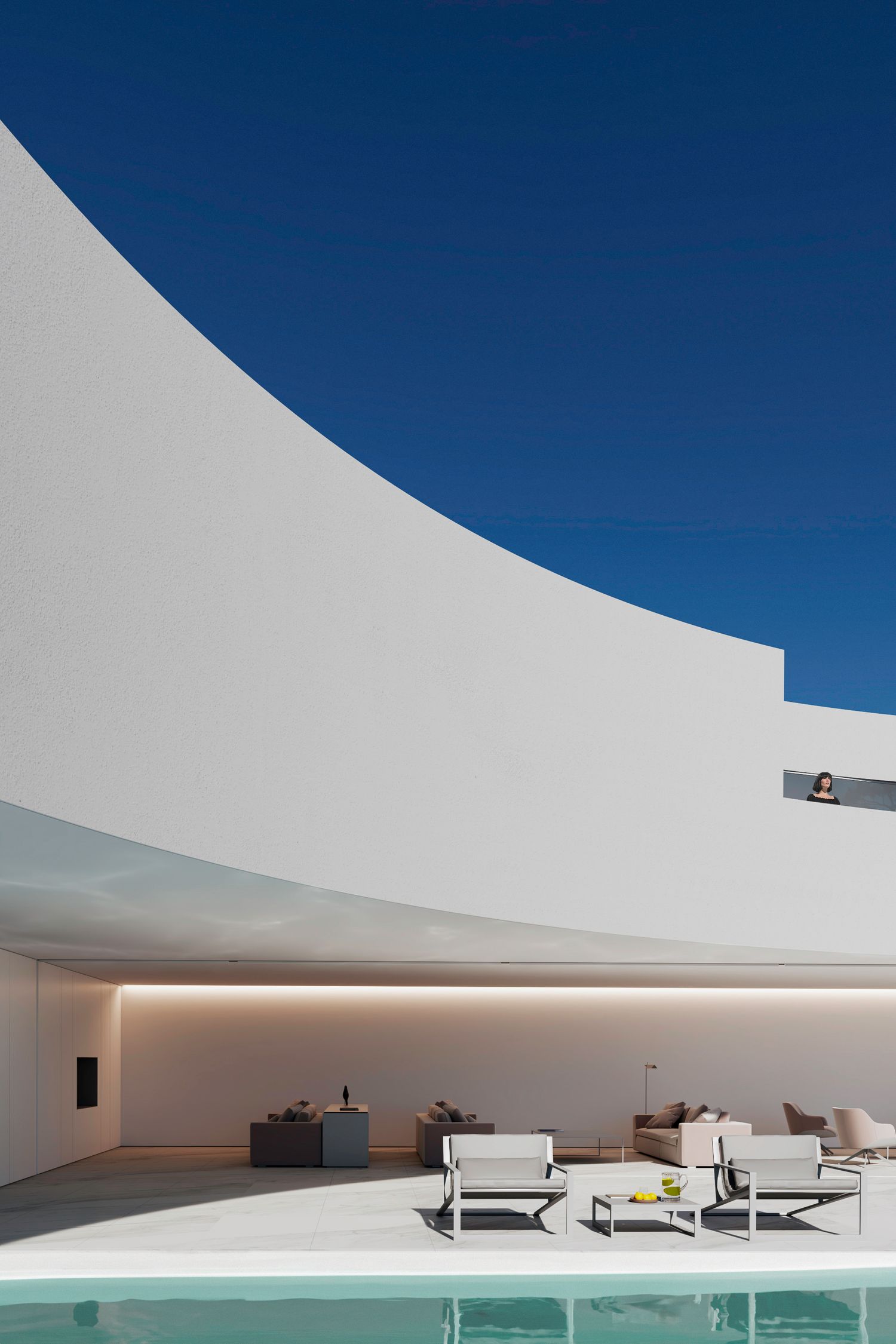 Luxurious poolside lounge area with curved white walls and modern outdoor furniture.