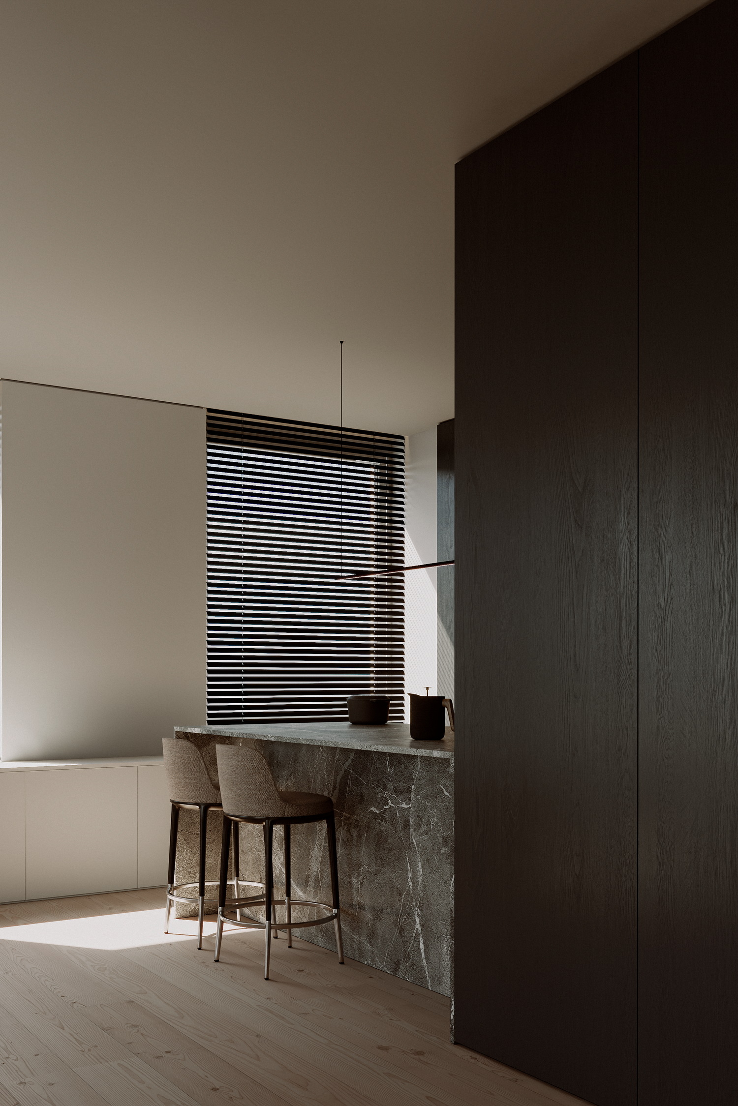 Minimalist kitchen with marble island, beige bar stools, dark wood cabinetry, and horizontal window blinds on light hardwood floors.