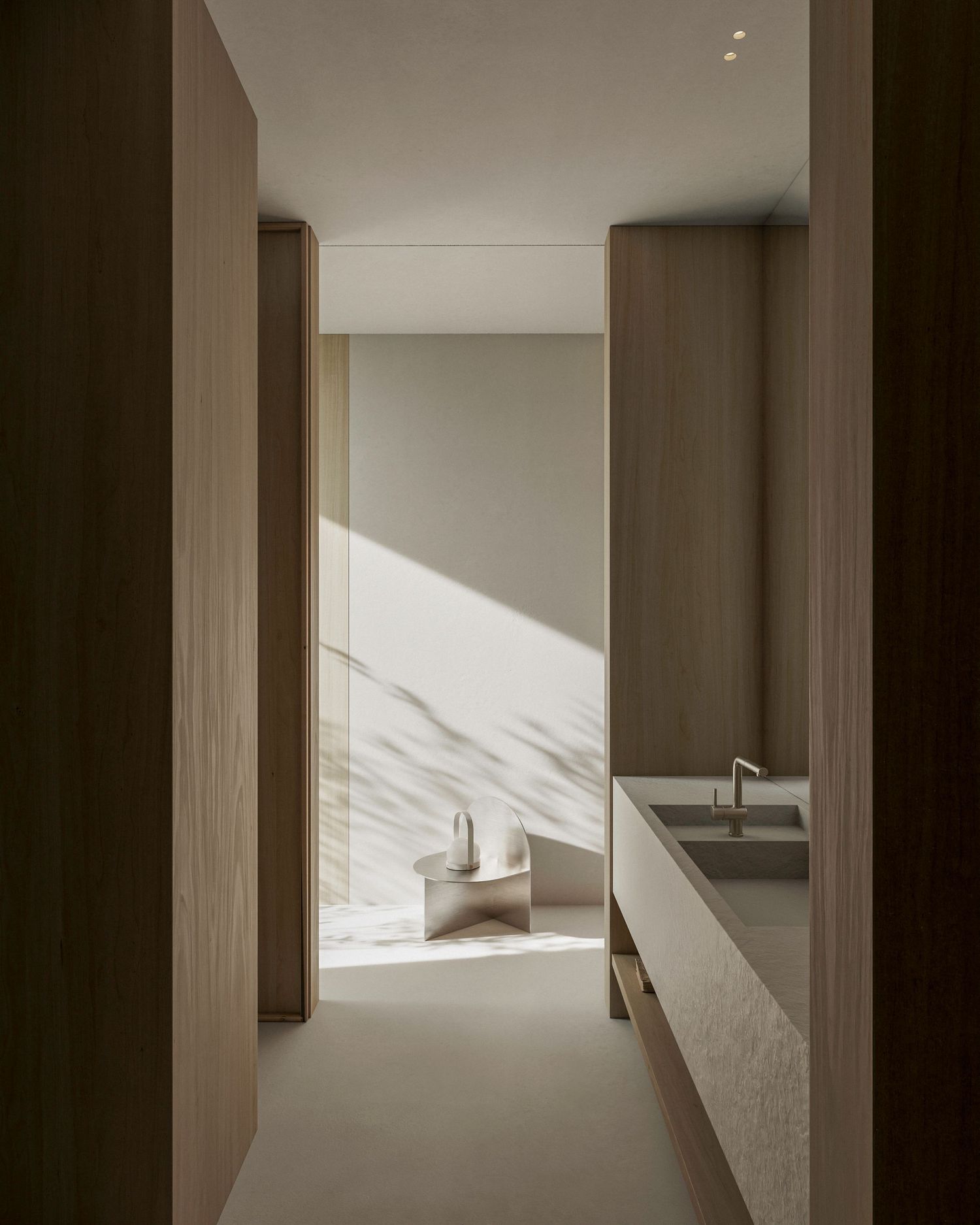 Minimalist interior hallway with wooden panels, marble surfaces and dramatic natural light casting angular shadows.