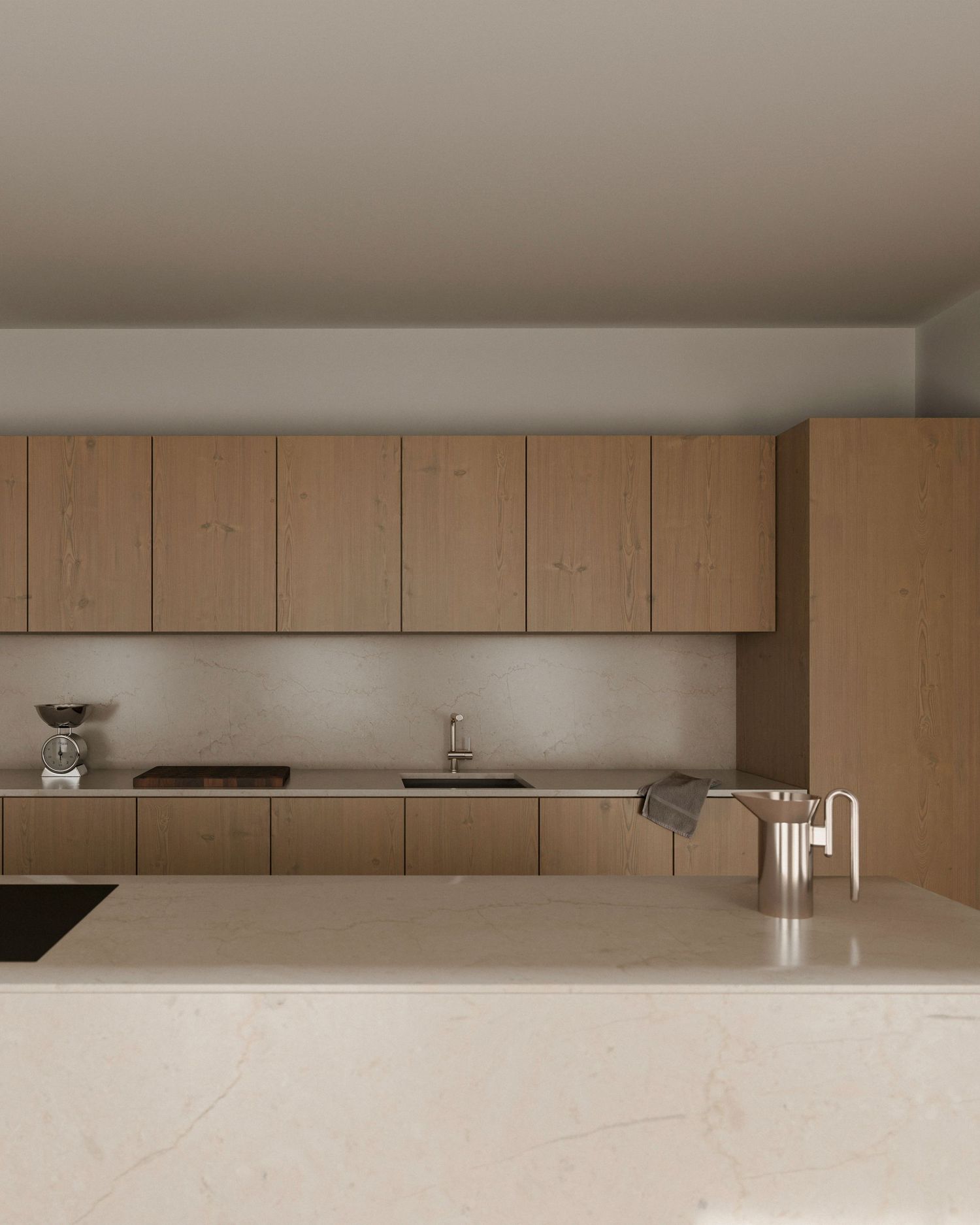 Minimalist modern kitchen with light wood cabinets and marble countertops features clean lines and neutral tones.
