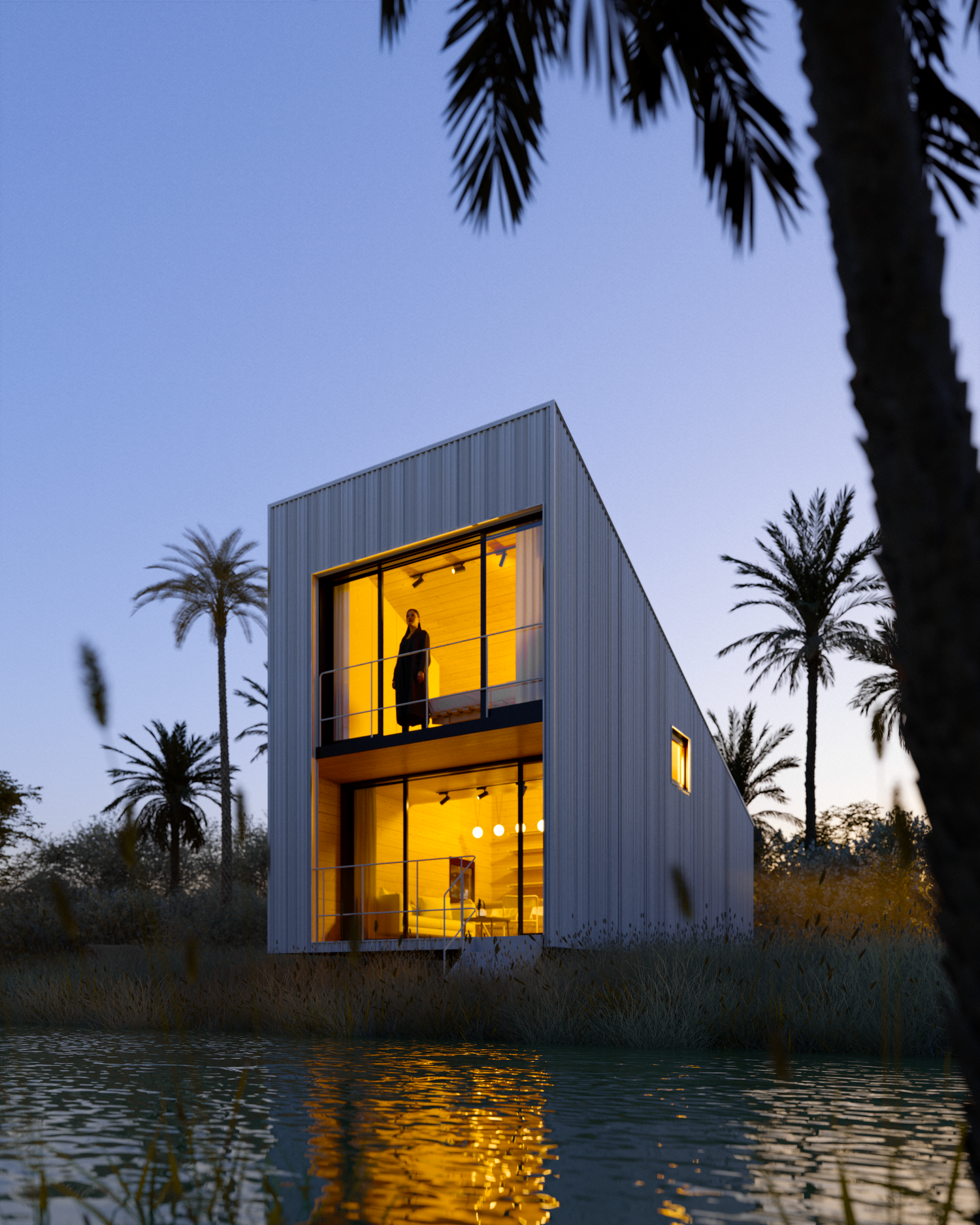 Sleek waterfront house glows warmly at dusk with palm trees silhouetted against blue sky.