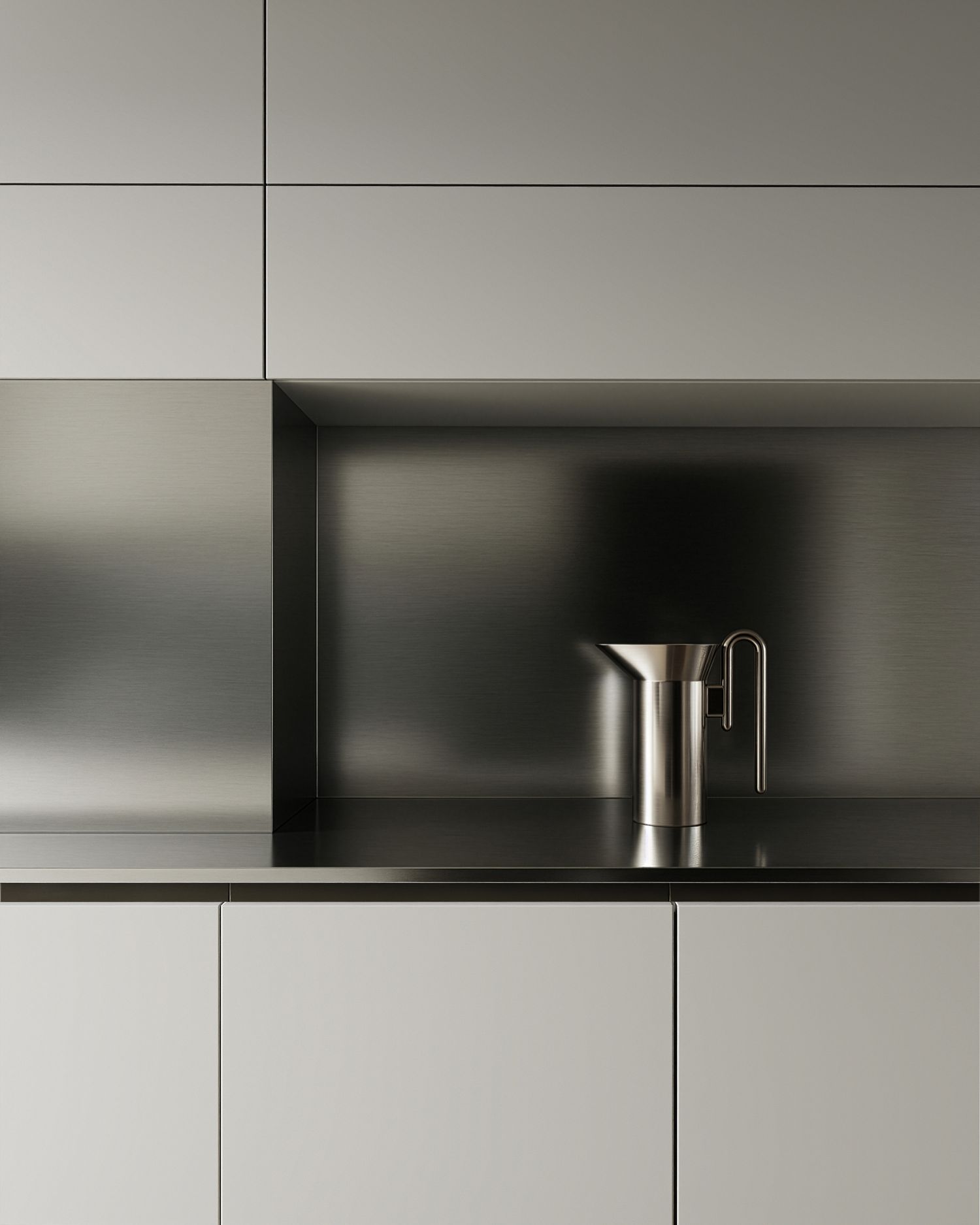 Minimalist kitchen niche with dark metal backsplash, sleek cabinetry, and a polished stainless steel pitcher on black countertop.