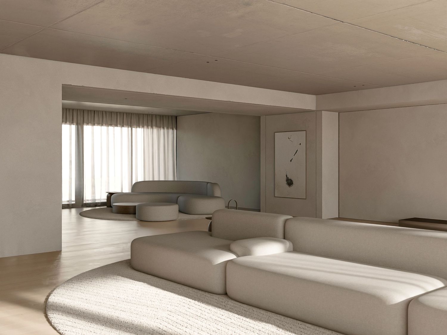 Modern minimalist living room with curved modular beige sectional sofa and natural lighting through sheer curtains.